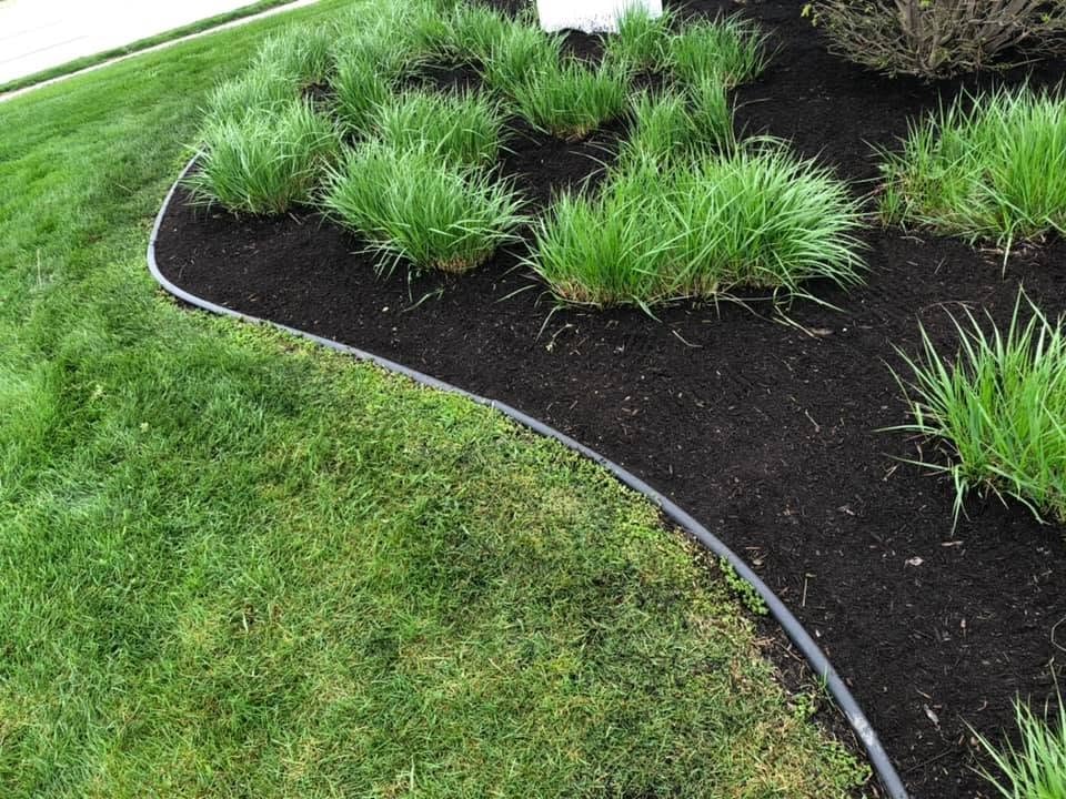 Fresh mulch garden bed installation